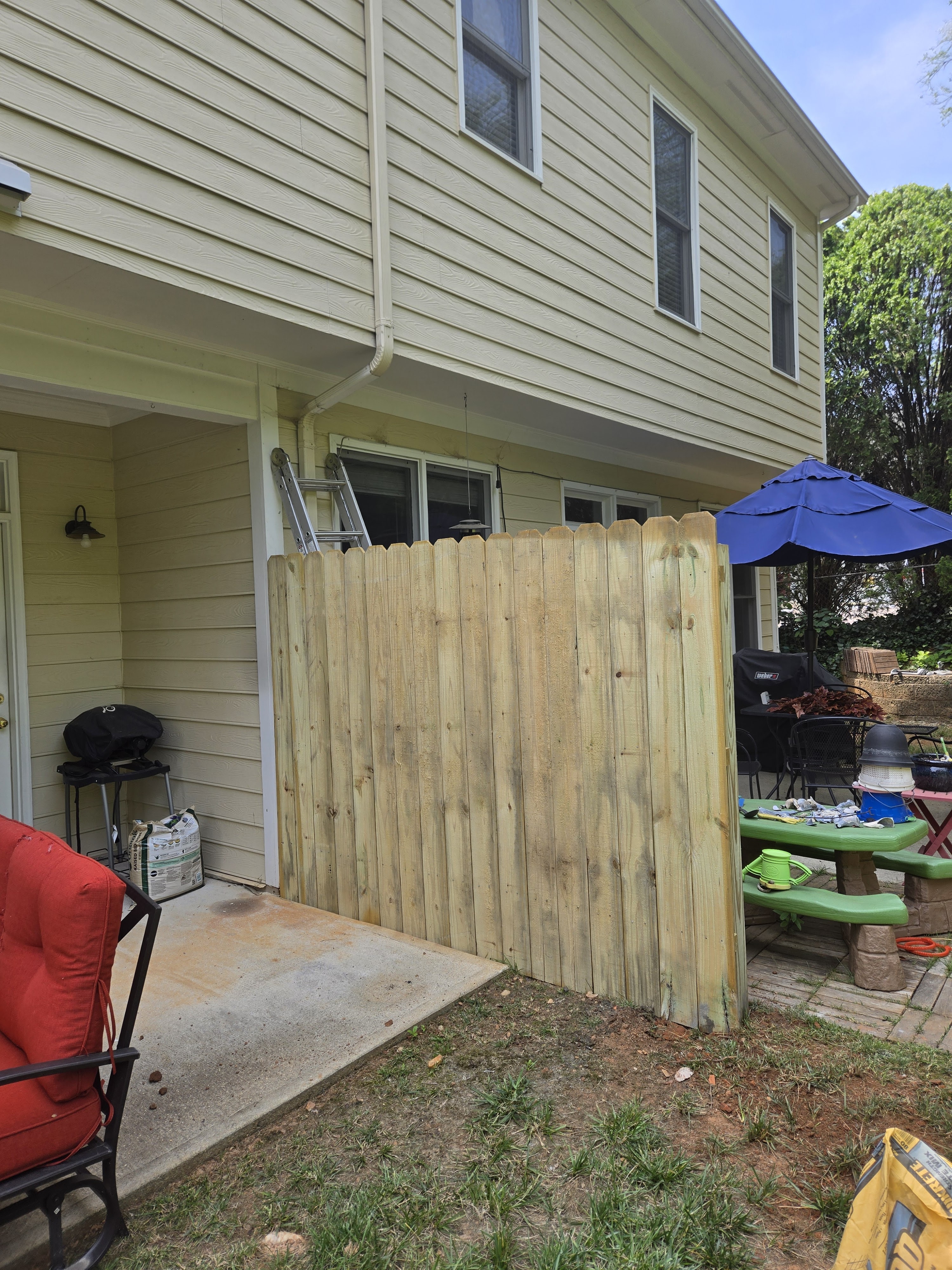 Wooden privacy fence under construction